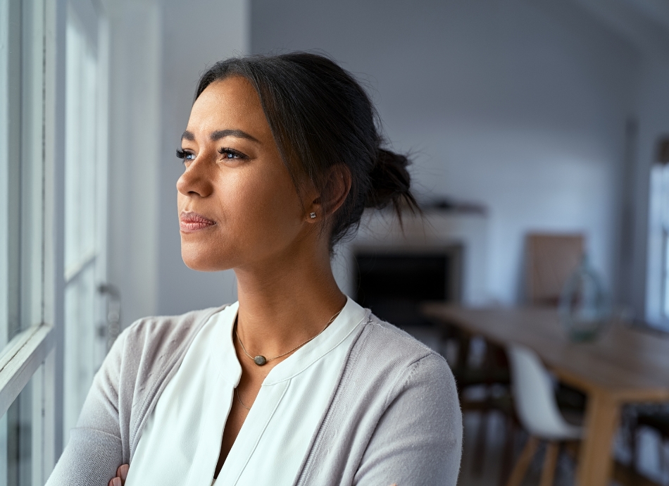 Woman looking thoughtfully out of the window