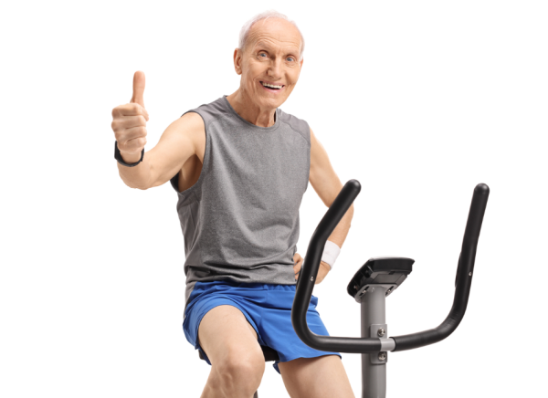 Older slim man on exercycle giving thumbs up