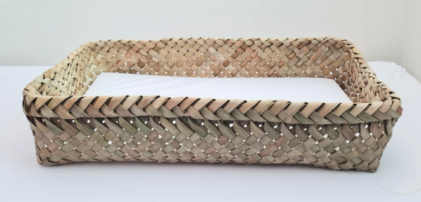 A wahakura, a baby bed woven from flax for a baby to co-sleep safely in